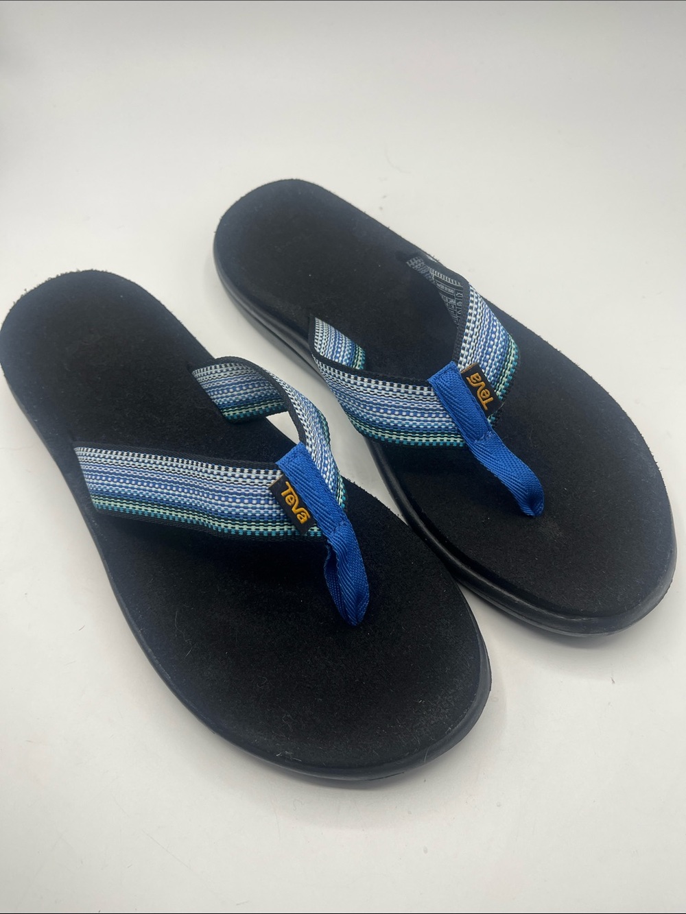 Teva Women’s Black Flip Sandals with Blue Striped Straps